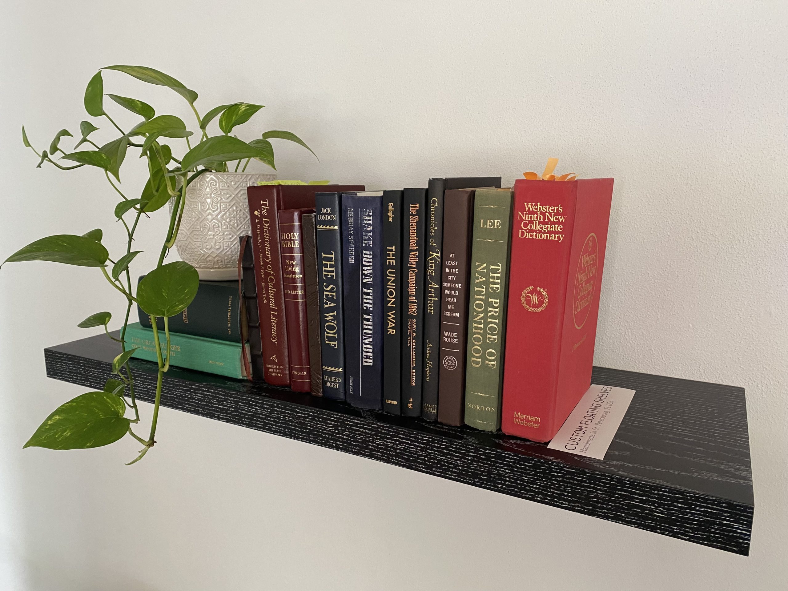 black stained oak wood with white wax pressed into the open grain creates striking pattern